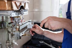 Man reparing water heater